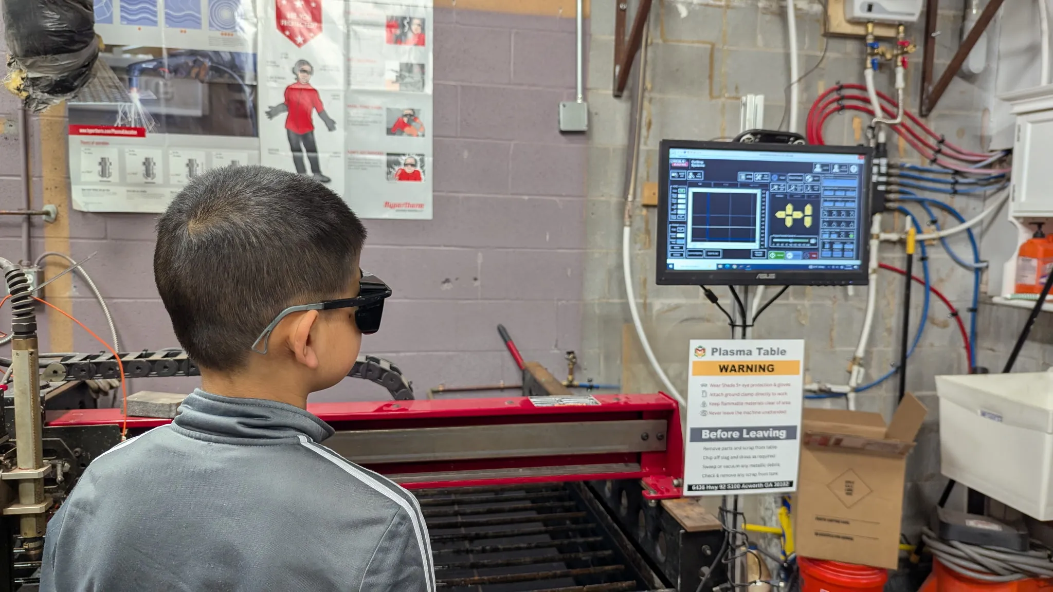 Student operating the CNC plasma cutter at FutureForward