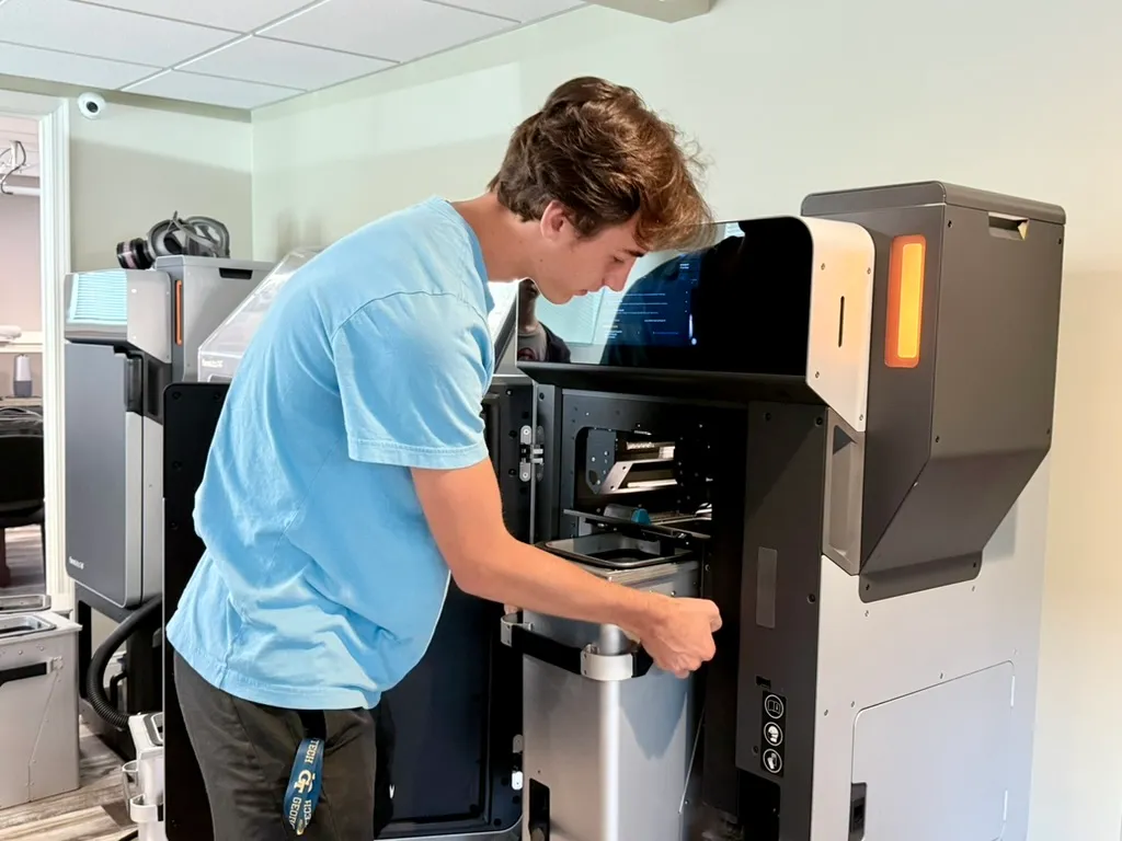 Student operating the Formlabs Fuse SLS printer at FutureForward